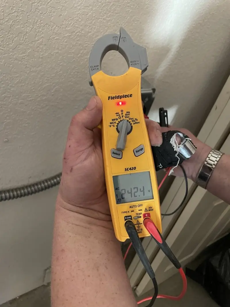 Voltage testing with clamp meter during Recessed Lighting Installation in Edgewood